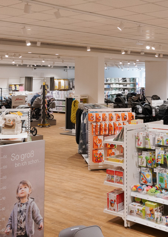 Interior of tamigo customer BabyOne's store, showing prams, babyclothes and toys